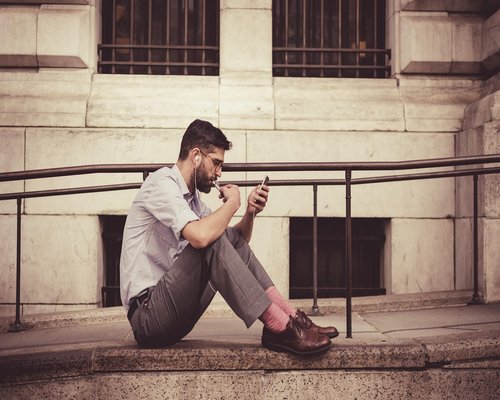 A person putting away their smartphone while sitting down to eat a healthy meal