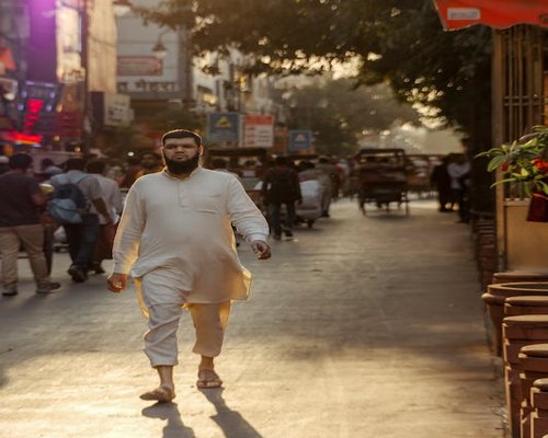 Busy Indian street with pedestrians walking confidently on the pavement